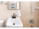 Close-up of the bathroom vanity and shower featuring a modern black faucet at 1171 Quebec St, Denver, CO 80220