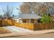 Charming exterior showcasing a well-maintained home with a fenced yard and driveway at 1171 Quebec St, Denver, CO 80220