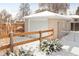 Detached garage with snow and shrubbery at 1171 Quebec St, Denver, CO 80220