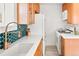 Kitchen with white countertops and copper faucet at 1171 Quebec St, Denver, CO 80220