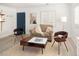 Cozy living room showcasing stylish seating, a modern coffee table, and a comfortable rug at 1171 Quebec St, Denver, CO 80220