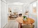 Inviting living room space with modern furniture and decor adjacent to a dining area and a kitchen at 1171 Quebec St, Denver, CO 80220