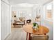 Open-concept living room featuring a dining table, modern decor, and plenty of natural light at 1171 Quebec St, Denver, CO 80220