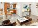 Bright living space featuring a kitchen view, modern furnishings, and ample natural light at 1171 Quebec St, Denver, CO 80220