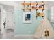 Stylish room featuring cute tent, open shelves, and light blue and white painted walls at 1171 Quebec St, Denver, CO 80220