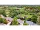 Community aerial view of homes nestled among mature trees, showcasing nearby green spaces at 2108 S Idalia St, Aurora, CO 80013