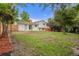 Expansive backyard with mature trees, a lush lawn, and a classic wooden fence for privacy at 2108 S Idalia St, Aurora, CO 80013