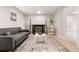 Finished basement with a cozy seating area, modern decor, and a decorative fireplace at 2108 S Idalia St, Aurora, CO 80013