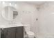 A sleek bathroom with a modern vanity, framed mirror, and a luxurious walk-in shower featuring elegant marble tiling at 2108 S Idalia St, Aurora, CO 80013