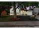 Charming two-story home with a well-maintained front yard and beautiful landscaping under the lush tree at 2108 S Idalia St, Aurora, CO 80013
