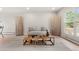 Bright living room featuring neutral tones, stylish decor, and large windows for natural light at 2108 S Idalia St, Aurora, CO 80013