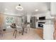 Modern living space showcasing an open floor plan with a kitchen, dining area, and living room with new appliances at 2108 S Idalia St, Aurora, CO 80013