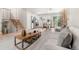 Open concept living area featuring a living room, dining area, and kitchen with stainless steel appliances at 2108 S Idalia St, Aurora, CO 80013