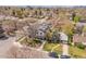 Aerial view of a home in a well-maintained neighborhood, with mature trees at 1303 Jersey St, Denver, CO 80220