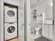 Well-lit bathroom with in-unit laundry and sleek, modern fixtures at 1303 Jersey St, Denver, CO 80220