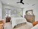 Cozy bedroom with decorative wall art, ample natural light, and wood furnishings at 1303 Jersey St, Denver, CO 80220