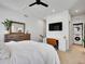 Bright bedroom with desk, in-unit laundry, and modern decor at 1303 Jersey St, Denver, CO 80220