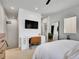 Bedroom featuring a desk, TV, and an ensuite bathroom at 1303 Jersey St, Denver, CO 80220