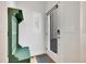 Cozy entryway with a storage bench and coat rack, providing functionality and style at 1303 Jersey St, Denver, CO 80220