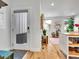 Bright entryway leading to an open-concept living space with hardwood floors at 1303 Jersey St, Denver, CO 80220