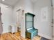 Functional entryway with built-in storage, adjacent to a conveniently located half-bath at 1303 Jersey St, Denver, CO 80220