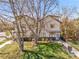 Beautiful two-story home with a charming entrance and a lush green lawn at 1303 Jersey St, Denver, CO 80220
