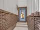 Stylish front door with brick surround, offering a welcoming entrance to the home at 1303 Jersey St, Denver, CO 80220