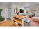Open-concept room showcasing a kitchen island and a cozy living space with stylish decor at 1303 Jersey St, Denver, CO 80220