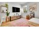 Relaxing living room featuring a TV console, decor, and views from the window at 1303 Jersey St, Denver, CO 80220