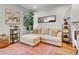 Comfortable living room with a plush sectional sofa, stylish decor, and natural light at 1303 Jersey St, Denver, CO 80220