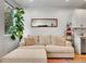 Bright living room with cozy sectional sofa, indoor plants, and modern decor at 1303 Jersey St, Denver, CO 80220