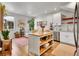 Open living space blending the kitchen, living, and dining areas for modern living at 1303 Jersey St, Denver, CO 80220
