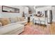 Stylish living space with a sofa, stools, kitchen appliances, and contemporary design at 1303 Jersey St, Denver, CO 80220