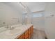 Bathroom with a double vanity, tile floor, tub, and a large mirror at 18168 E Caley Cir, Aurora, CO 80016