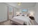 Relaxing bedroom with neutral colors and natural light from the window at 18168 E Caley Cir, Aurora, CO 80016
