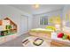 bedroom with whimsical decor, neutral carpet, and bright sunlight at 18168 E Caley Cir, Aurora, CO 80016
