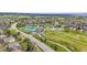 Beautiful aerial view of community park including tennis courts, play area, and green space at 18168 E Caley Cir, Aurora, CO 80016