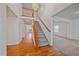 Welcoming foyer with hardwood flooring, staircase, and high ceilings, creating a grand entrance at 18168 E Caley Cir, Aurora, CO 80016