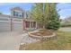 Beautifully landscaped front yard, and an inviting entrance, enhancing the home's curb appeal at 18168 E Caley Cir, Aurora, CO 80016