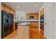 Kitchen with wood cabinets, stainless appliances, and central island at 18168 E Caley Cir, Aurora, CO 80016
