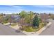 Charming home featuring a well-maintained front yard with mature trees and a welcoming entrance at 18168 E Caley Cir, Aurora, CO 80016