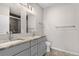 Bathroom with dual sinks and a granite vanity countertop at 847 E 98Th Ave # 1806, Thornton, CO 80229