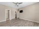 Spacious bedroom with vinyl plank flooring, ceiling fan, and a walk-in closet at 847 E 98Th Ave # 1806, Thornton, CO 80229