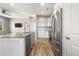 Bright kitchen open to living area features stainless steel appliances, granite counters, and modern fixtures at 847 E 98Th Ave # 1806, Thornton, CO 80229