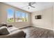 Bright living room with a large window, a ceiling fan, hardwood floors and comfortable couch at 847 E 98Th Ave # 1806, Thornton, CO 80229