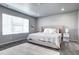 Serene bedroom featuring a comfortable bed, soft carpet, and a well-lit, relaxing atmosphere at 952 Morning Glory Rd, Brighton, CO 80640