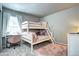Charming bedroom with bunk beds, a desk, and plenty of natural light at 952 Morning Glory Rd, Brighton, CO 80640