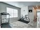 Cozy bonus room with carpet, natural light, and space for exercise equipment at 952 Morning Glory Rd, Brighton, CO 80640