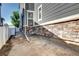 Exterior view showcasing the foundation and side of the house and yard at 952 Morning Glory Rd, Brighton, CO 80640