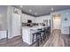 Modern kitchen with an island, stainless steel appliances, ample counter space and bar stool seating at 952 Morning Glory Rd, Brighton, CO 80640